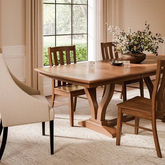 Dining room with wooden table and chairs, large window in the background