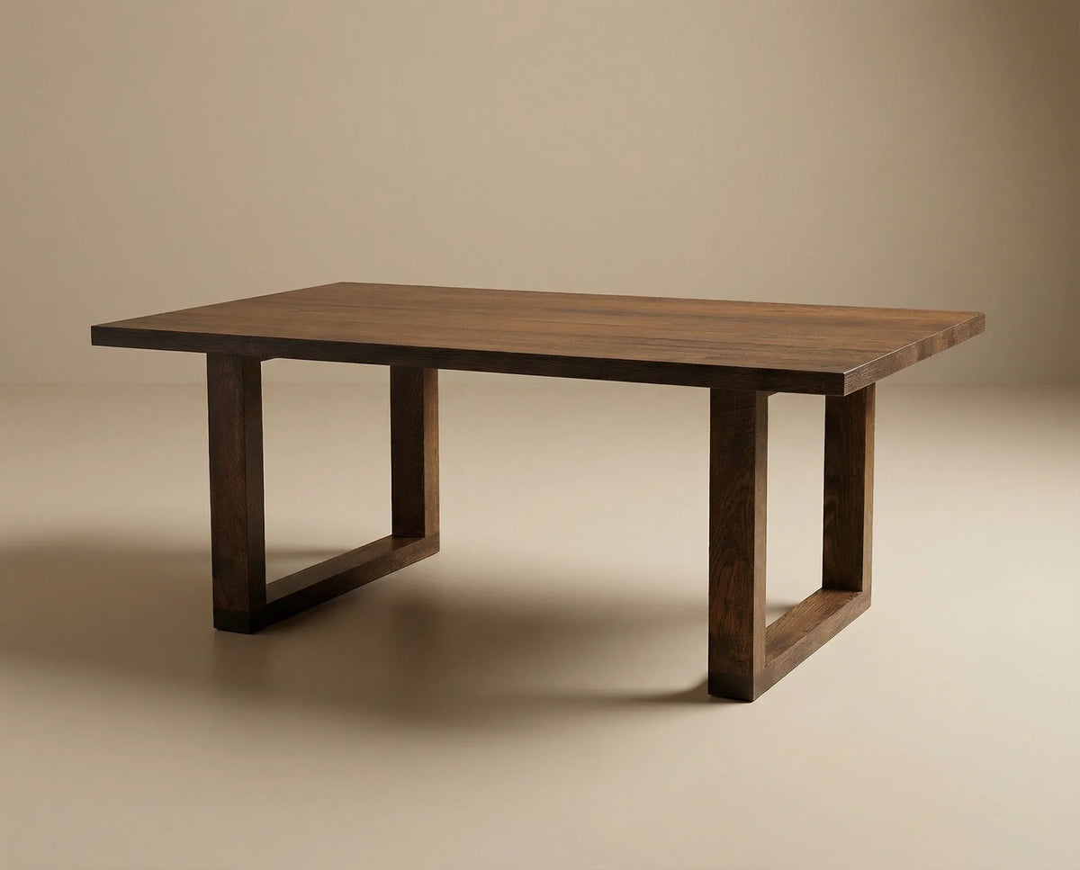 Calder dining table with dark finish and panel legs
