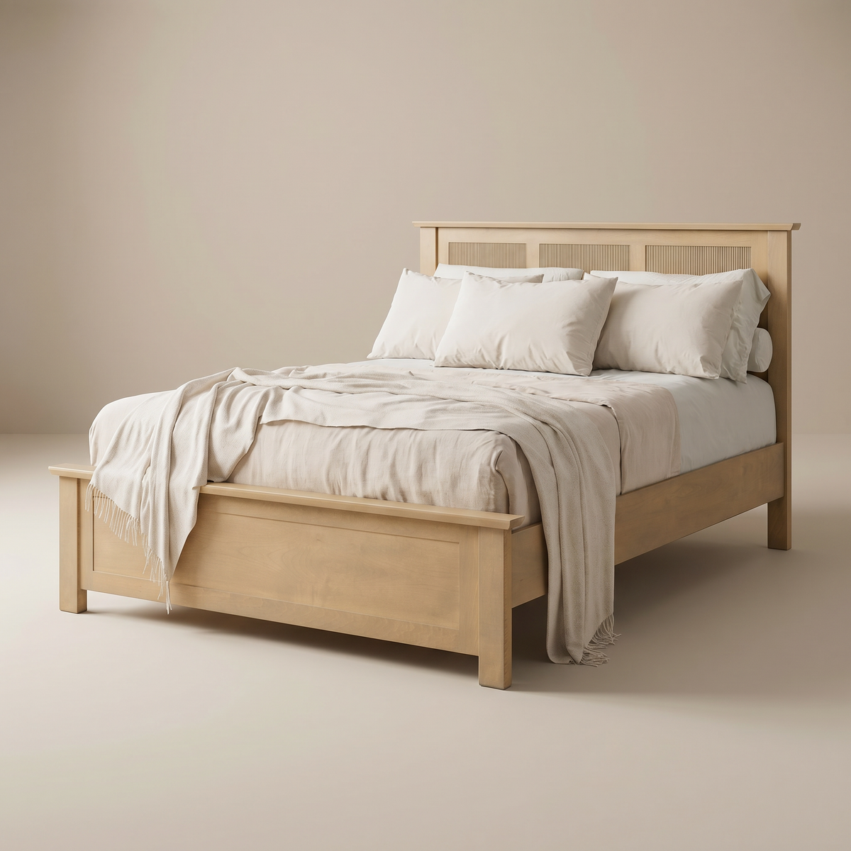 Lassen bed with white bedding against a beige wall