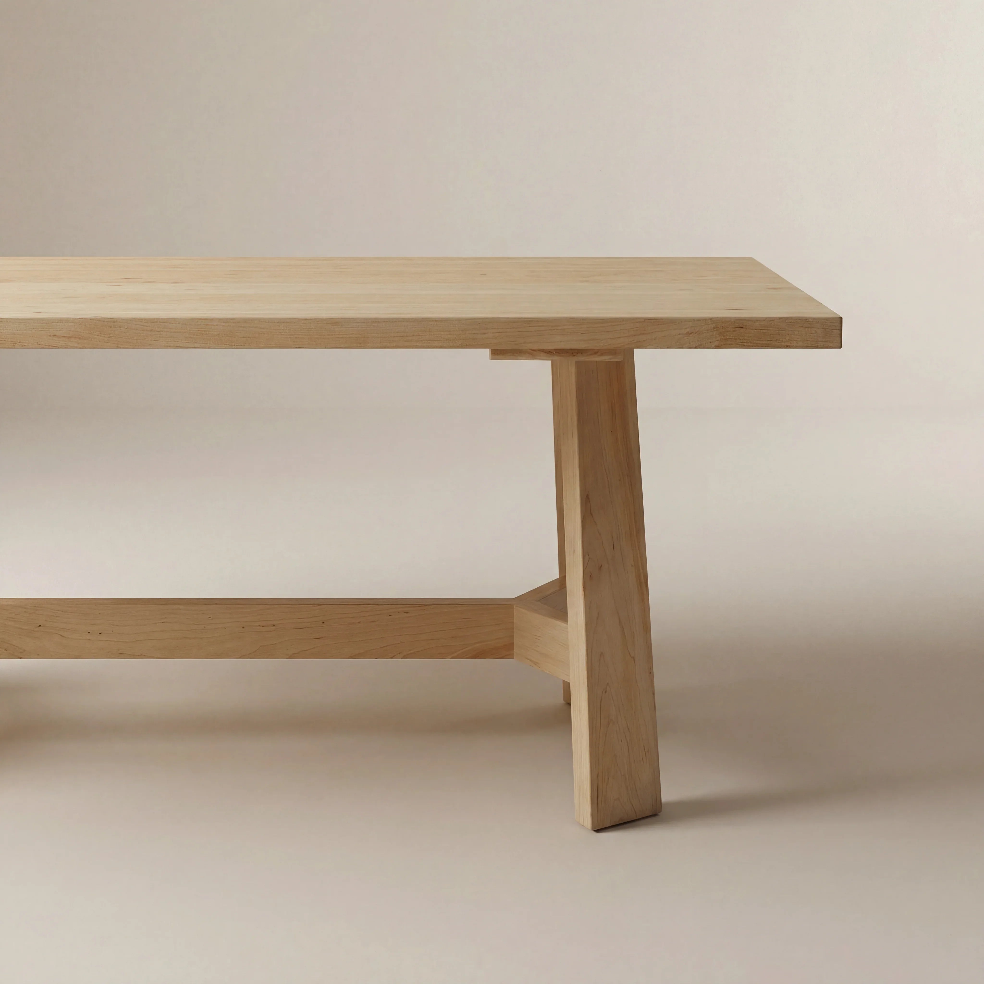 Wooden table with a minimalist design on a plain background