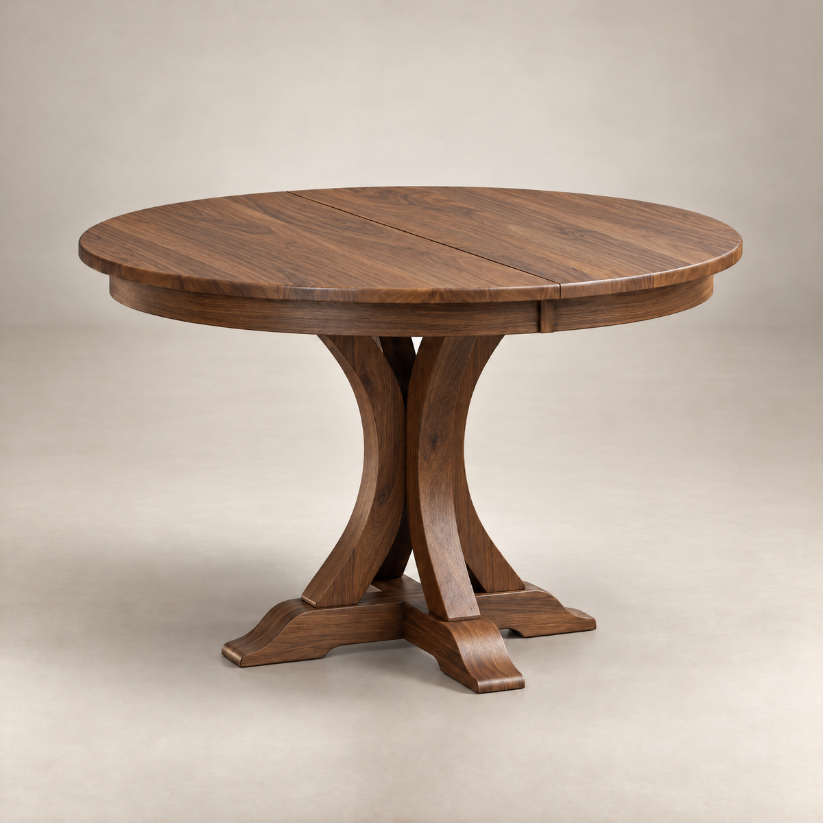 Cascade round pedestal dining table in walnut with a curved split base