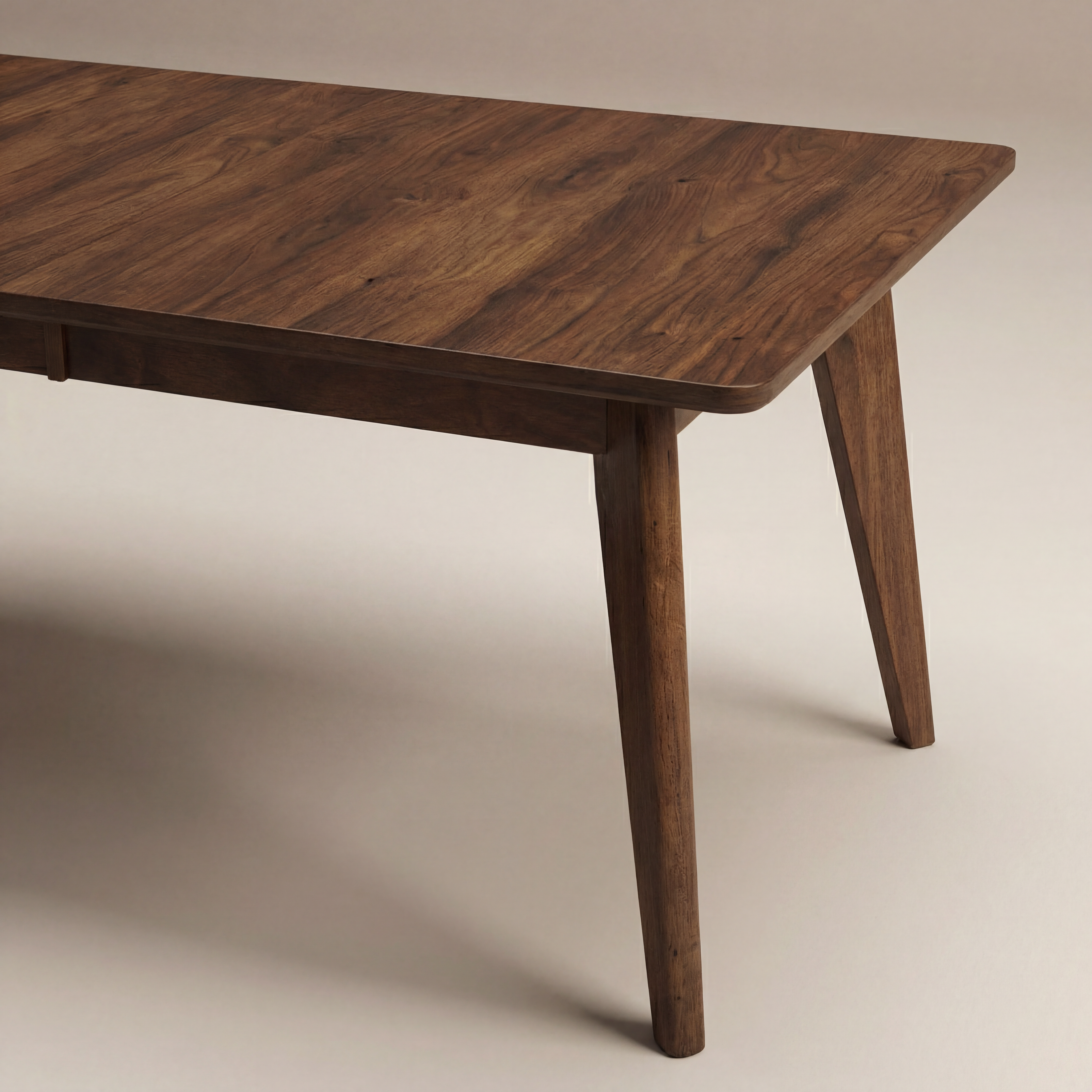 Wooden table with a warm brown finish on a plain background