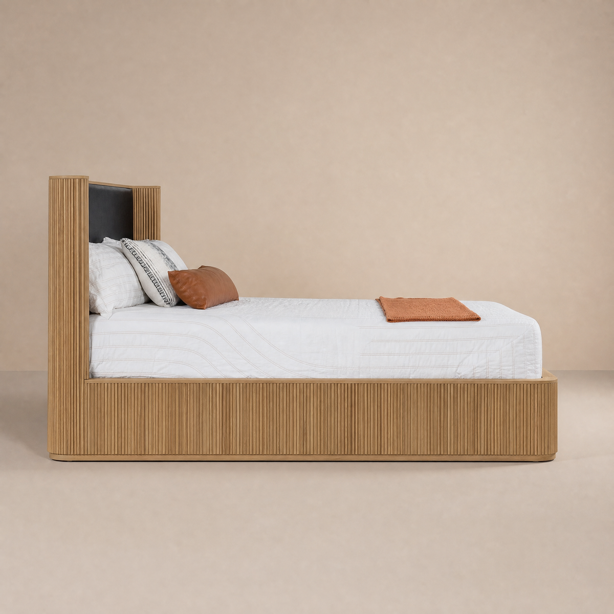 Sundance bed with white bedding on a beige background