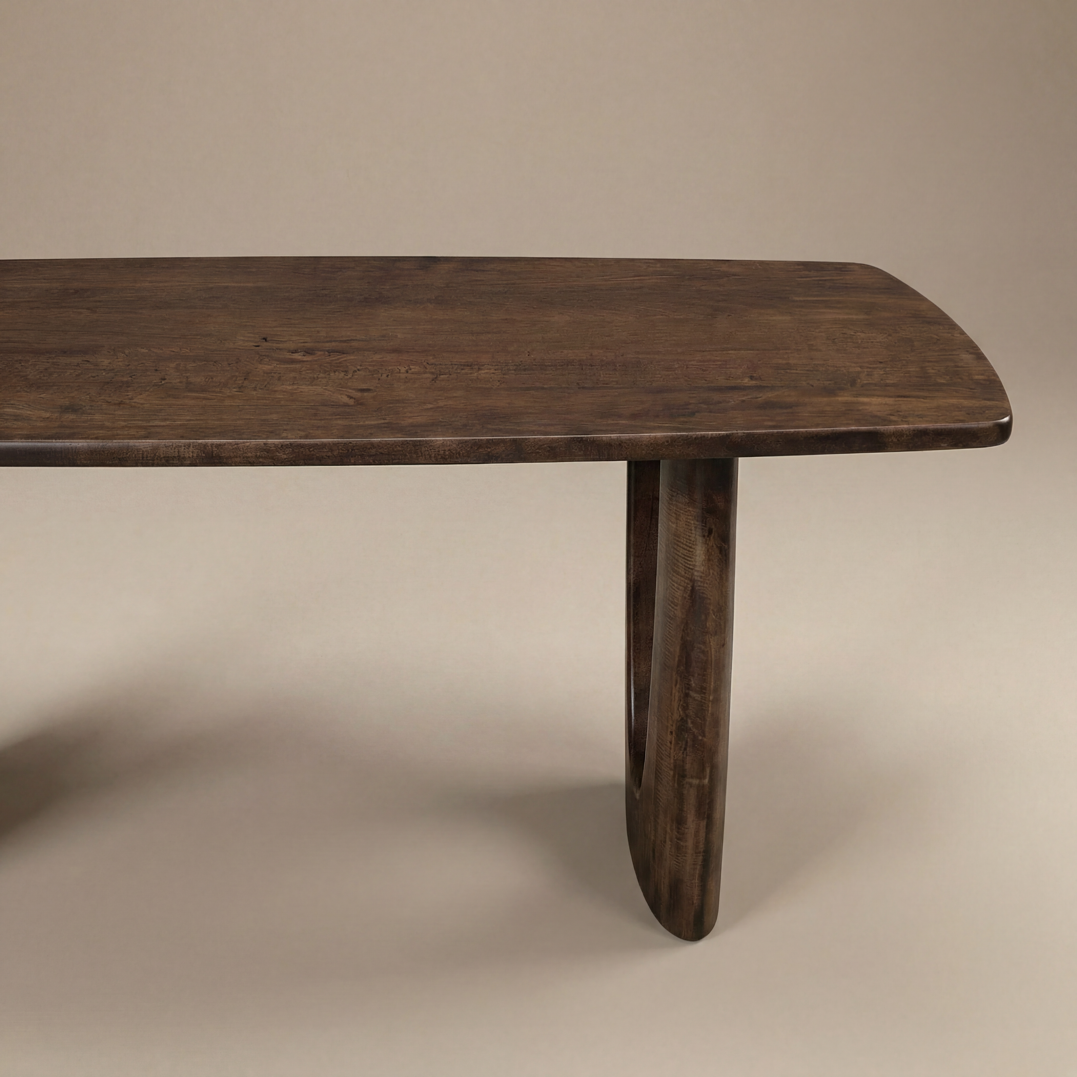 Wooden table with a single leg on a beige background